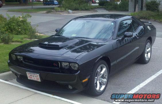 Black 2011 Dodge Challenger parked on pavement