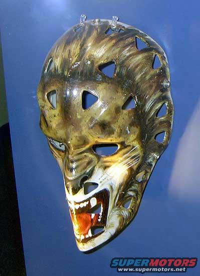 Hockey goalie mask painted like a snarling cat or tiger