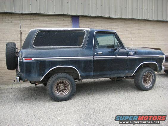 1979 Ford Bronco, dark blue, with spare tire mounted on rear door