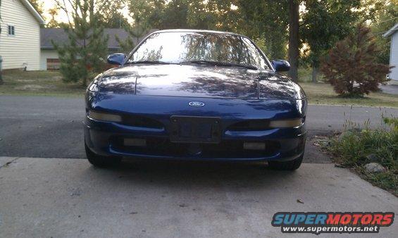 Front view of a blue 1994 Ford Probe parked on a driveway