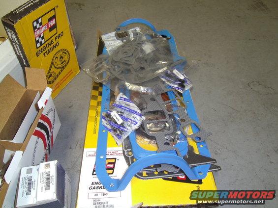 Engine gasket set with blue and gray gaskets, packaged in boxes labeled Engine Pro