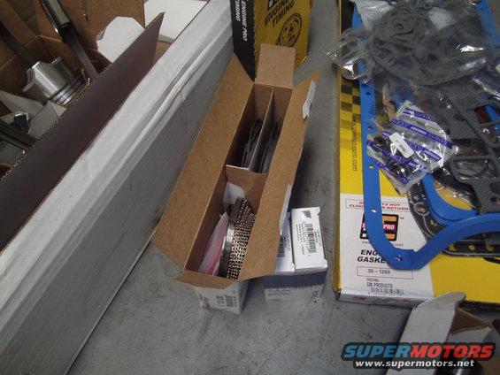 Engine gasket set and other engine parts in boxes