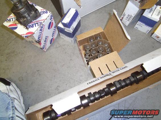Camshaft and box of lifters, both Melling brand engine parts. "FRAGILE HANDLE WITH CARE" text visible