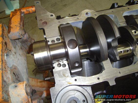 Engine block with crankshaft installed, showing bearings and counterweights