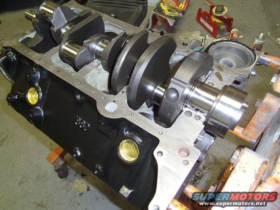 Engine block with crankshaft installed, on an engine stand