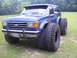 1992 Ford Bronco - This modified Ford Bronco sits high on enormous tires, altering its original appearance.