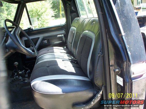 Interior of a 1979 Ford F-250 pickup truck, showing the bench seat and dashboard