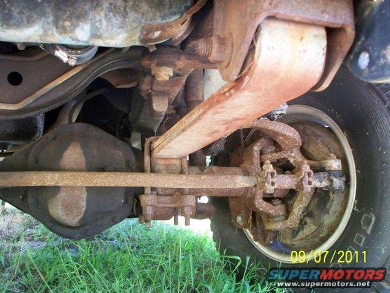 close-up of rusty truck suspension and rear axle