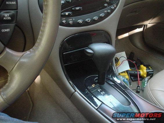 dsc00752.jpg This is my custom radio install. Since i have digital climate controls, I can not install a radion in the conventional location. as a result, I custom mounted it where my storage pocket use to be. The nice thing is that its almost invisible to someone looking in and not removable when the shifter is in park!
