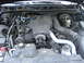 2003 Ford Crown Victoria - The engine bay of a 2003 Ford Crown Victoria displays its V8 engine and associated components.