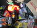 2003 Ford Crown Victoria - A collection of automotive fluids and tools are packed into the trunk of a vehicle.