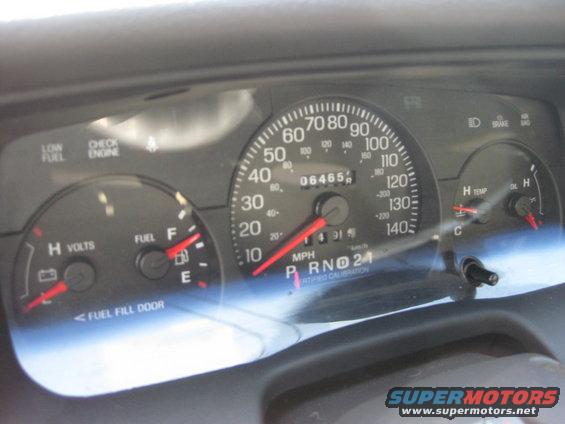 2003 Ford Crown Victoria dashboard with speedometer, fuel gauge, voltmeter, and temperature gauge