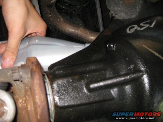 Rear differential with 'QSI' marking and exhaust pipe