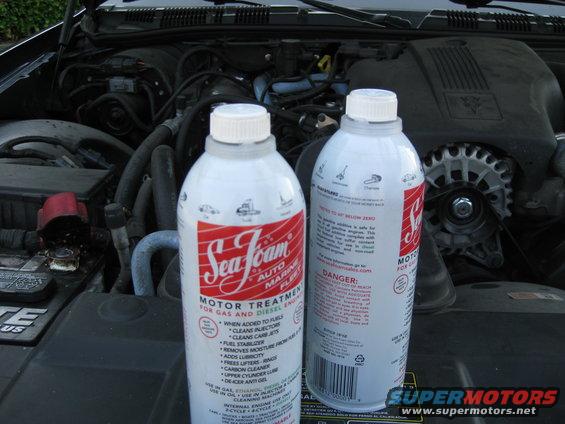 2003 Ford Crown Victoria engine bay with two Sea Foam cans