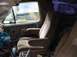 1986 Ford Bronco - Interior view of a 1986 Ford Bronco, highlighting the seats and door panel details.