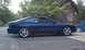 1994 Ford Probe - Side view of a blue 1994 Ford Probe GT parked outdoors.