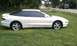 1994 Ford Probe - Side profile of a white Ford Probe GT with tinted windows and a rear spoiler.
