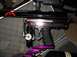 1986 Ford Bronco - A close-up view of a black paintball marker with visible text and a pressure gauge.