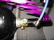 1986 Ford Bronco - Close-up of an air tank assembly purple decorative fins and a blue hose, with visible text from Supermotors.net.