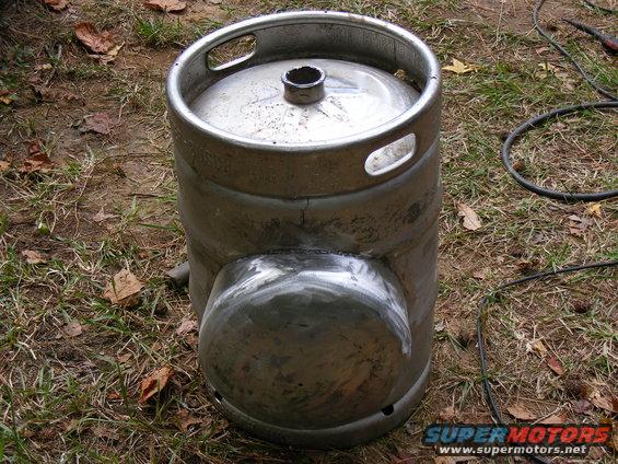Modified beer keg with welded section, outdoors