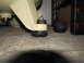 1993 Ford F-250 - Rubber and metal mounting feet are visible on an air compressor, attached to a concrete floor.