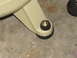 1993 Ford F-250 - A close-up view of a vehicle's suspension component, showing a rubber bushing and bolt assembly.