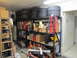 1993 Ford F-250 - A cluttered garage scene with various storage items, including tires, boxes, and equipment, filling the shelves.
