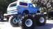1989 Ford Bronco - A modified Ford Bronco, painted blue with 'High Horse' graphics, sits on massive tires.