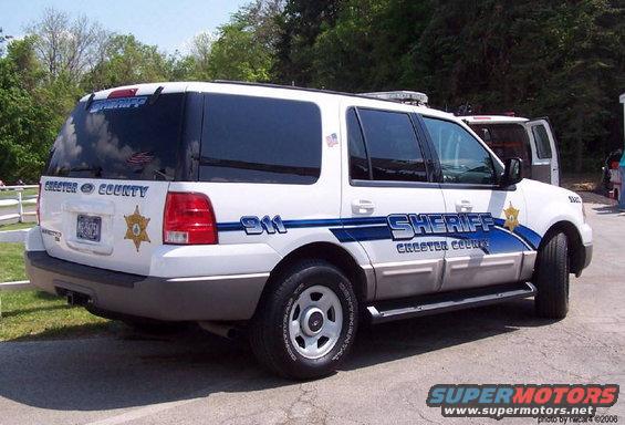 Chester County Sheriff SUV parked outside, with 'SHERIFF' and 'CHESTER COUNTY' text on the side