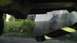1989 Ford Bronco - The underside of a vehicle is visible, with a striped pole in the foreground.