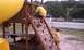 1979 Ford Bronco - Children enjoy a day of play on a wooden playground structure with a slide and climbing wall.