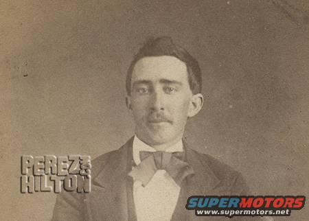 Sepia-toned portrait of a man with a mustache and bow tie