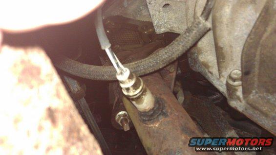 Exhaust pipe with oxygen sensor, close-up view