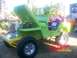 1989 Ford Bronco - A modified Willys Jeep is displayed with its hood open, revealing the engine bay.