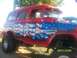 1989 Ford Bronco - This lifted SUV features a patriotic American flag paint scheme on its exterior.