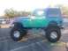 1989 Ford Bronco - Customized Jeep CJ-7 shows off its lifted suspension and unique paint job. The photo was taken on September 1, 2008.