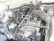 1994 Jeep Cherokee - Close-up view of the engine bay, highlighting various hoses, wiring, and engine parts within a Jeep Cherokee.