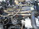 1994 Jeep Cherokee - Close-up view of an engine bay, showing various hoses, wiring, and engine components.