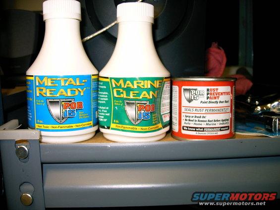 Two bottles labeled POR-15 Metal-Ready and Marine Clean, and a can of POR-15 Rust Preventive Paint
