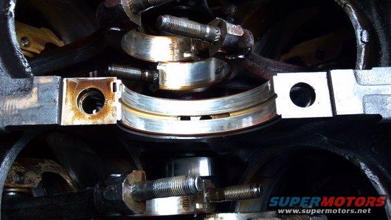 Close-up of engine crankshaft bearings and connecting rod caps