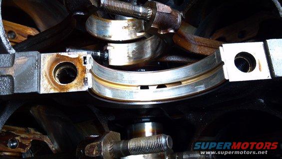 Engine crankshaft bearings with visible wear
