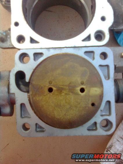 image00681.jpg Thats the 5.4 butterfly over the 4.6 hole.  Yes, it is quite a bit larger...NO, I did not measure it to find out.