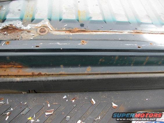 Rust on rear, along line of rear and rear bed along spot weld line