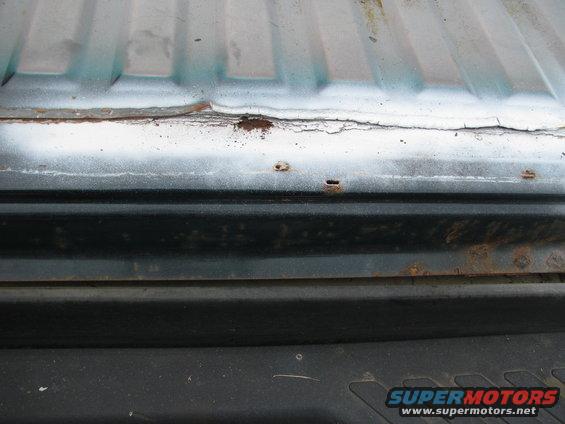 Rust on rear, along line of rear and rear bed along spot weld line