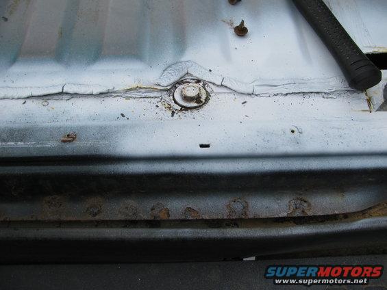 Rust on rear, along line of rear and rear bed along spot weld line