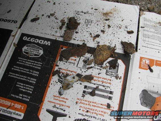 Rust and debris scattered on cardboard with Ridgid branding