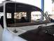 1986 Ford Bronco - The interior of a 1986 Ford Bronco shows the windshield removed, revealing the dashboard and seats.
