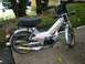 1999 Tomos Targa - A silver moped with 'TOMOS' and 'TARGA' graphics is parked on a concrete surface.