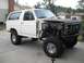 1986 Ford Bronco - This Ford Bronco is missing its hood and front fender, revealing its engine components and chassis.