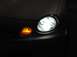 1998 Ford Taurus - Front close-up of driver side headlamp turned on...